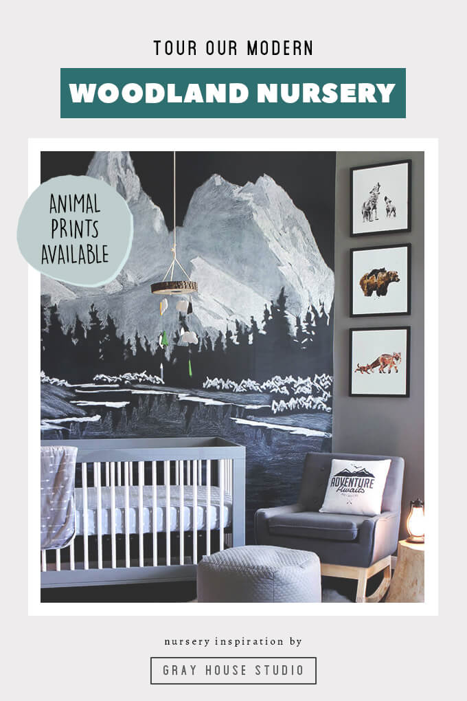  Nursery complete with hand drawn chalk mural, whimsical woodland watercolor prints. The woodland nursery design features mountains and black, white, and gray nursery elements. We designed a monochromatic nursery that is a gender neutral nursery perfect for a child who loves exploring the outdoors.